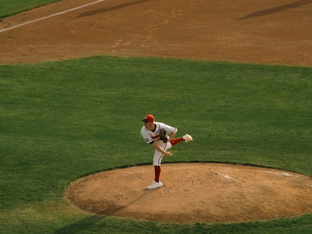 a baseball player throwing a ball